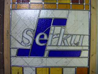 Bedrijfslogo in glas in lood